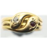 An antique 18ct gold gents double snake ring, the snake heads set with a diamond and ruby, size R/S,