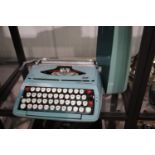 Smiths portable typewriter in turquoise colour case, P&P Group 3 (£25+VAT for the first lot and £5+