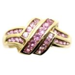 9ct gold pink sapphire set dress ring, size I/J, 2.8g. P&P Group 1 (£14+VAT for the first lot and £