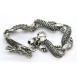 White metal Tibetan silver dragon bracelet, L: 22 cm. P&P Group 1 (£14+VAT for the first lot and £