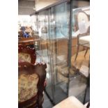 Three IKEA type display cabinets, some with shelves, H: 163 cm. This lot is not available for in-