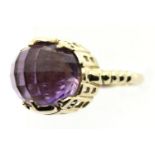 9ct gold solitaire ring set with a large faceted amethyst, size P, 7.1g. P&P Group 1 (£14+VAT for