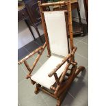 Vintage American safety rocking chair with turned supports. This lot is not available for in-house