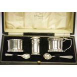 Cased hallmarked silver cruet set with Bristol blue liners, assay Birmingham. This lot is not