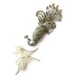 Silver filigree butterfly and a marcasite peacock brooch. P&P Group 1 (£14+VAT for the first lot and