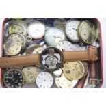 Tin of pocket watch parts, faces, movements etc. P&P Group 1 (£14+VAT for the first lot and £1+VAT