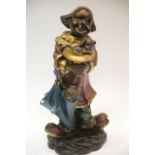 Contemporary bronze clown with dog figurine cold painted and plaster filled, H: 30 cm. This lot is