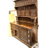 19thC Jacobean revival oak dresser, the heavily carved sideboard base of cupboards and drawers