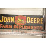 John Deere enamel sign, L: 90 cm. P&P Group 2 (£18+VAT for the first lot and £3+VAT for subsequent