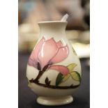 Moorcroft vase in the Magnolia pattern, 14 cm approximately. P&P Group 2 (£18+VAT for the first