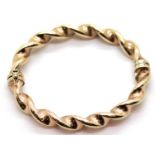 9ct rose gold twist bangle with magnetic fastening, 12.3g. P&P Group 1 (£14+VAT for the first lot