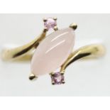 9ct gold rose quartz and pink sapphire set crossover ring, size P, 2.8g. P&P Group 1 (£14+VAT for