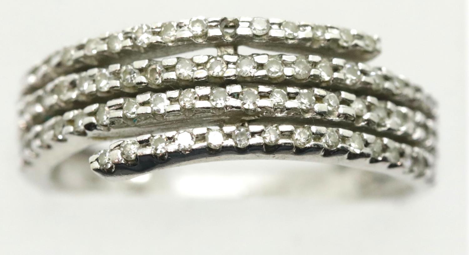 9ct white gold and diamond crossover ring, size T, 3.7g, one stone missing. P&P Group 1 (£14+VAT for