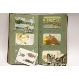 Large album of antique and vintage postcards, subjects to include humerous, topographical and