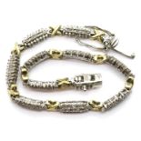 Silver diamond set bracelet with gold washed spacers, L: 19 cm, 9g. P&P Group 1 (£14+VAT for the