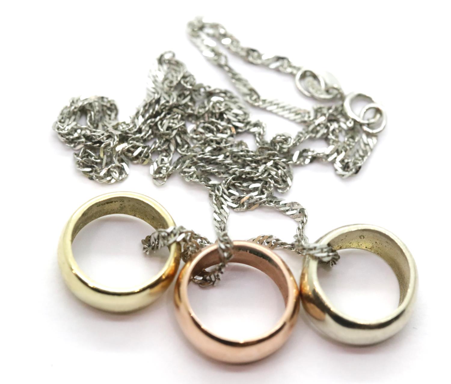 9ct yellow, white and rose gold three-piece pendant on a 9ct white gold neck chain, 4.8g. P&P