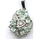 18ct white gold green stone and diamond set drop pendant, L: 2 cm, 2.9g. P&P Group 1 (£14+VAT for