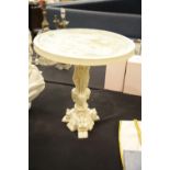 Small cast occasional table with dragon and elephant design, H: 50 cm. This lot is not available for