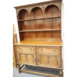 Late 19thC oak dresser, the sideboard base of cupboards and drawers supporting a two shelf plate