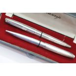 Boxed Bolascrip 900 silver pen and pencil set.