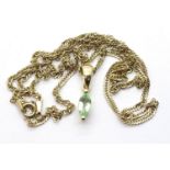 9ct gold green stone pendant on a 9ct gold twist chain L: 48 cm, 2.8g. P&P Group 1 (£14+VAT for