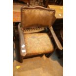 Antique oak framed leather backed single chair. This lot is not available for in-house P&P.