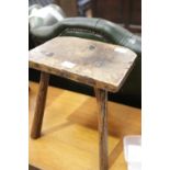 Antique 19thC ash and elm stool. This lot is not available for in-house P&P.