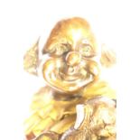 Contemporary bronze clown with dog figurine cold painted and plaster filled, H: 30 cm. This lot is