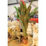 Collection of cast plastic garden figurines and an artificial plant. This lot is not available for