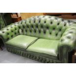 20thC Chesterfield style two-seater sofa, in green leather, L: 195 cm. This lot is not available for