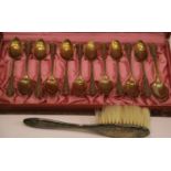 Boxed set of twelve teaspoons stamped 800 and a silver backed childs brush. P&P Group 1 (£14+VAT for