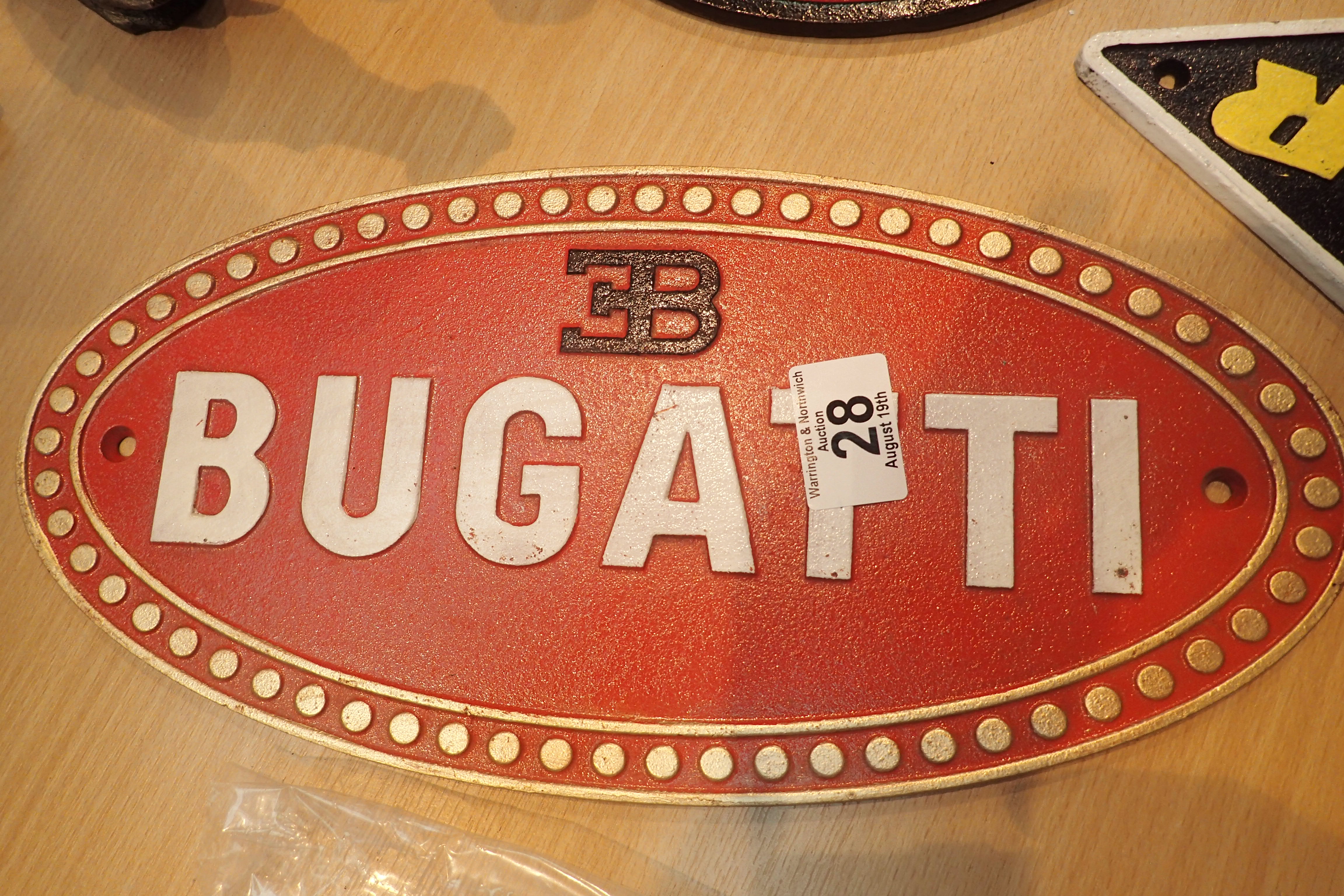 Cast iron Bugatti sign, L: 35 cm. P&P Group 2 (£18+VAT for the first lot and £3+VAT for subsequent