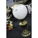 Large Victorian type brass oil lamp with milk glass globe shade. This lot is not available for in-