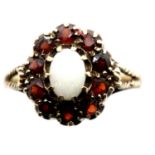 9ct gold, garnet and opal ring, size O, 3.0g. P&P Group 1 (£14+VAT for the first lot and £1+VAT