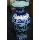 Oriental vase with green background decorated with blue figurines and horses, H: 35 cm. P&P Group