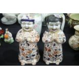 Two Oriental figurines of boy and girl, H: 31 cm. P&P Group 3 (£25+VAT for the first lot and £5+