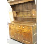 George II provincial oak dresser, the open plate rack with two small cupboards sits above a