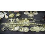 Collection of 19th century horse brasses, some still mounted on leather straps. P&P Group 3 (£25+VAT