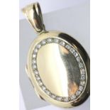 9ct gold stone set oval locket, 7.8g. P&P Group 1 (£14+VAT for the first lot and £1+VAT for