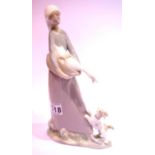 Lladro glazed ceramic figure of a girl holding a goose, H: 26 cm. P&P Group 2 (£18+VAT for the first