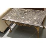 Gilt cast metal coffee table, Rococo design with claw and ball supports, having a rectangular