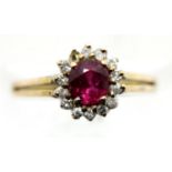14ct gold dress ring with central ruby and diamond surround, one diamond missing but present in