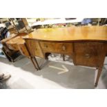 Regency style mahogany serpentine front sideboard of cupboards and drawers. Not available for in-