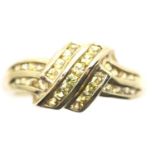 9ct gold ring channel set with yellow stones, size P, 2.9g. P&P Group 1 (£14+VAT for the first lot