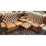 Modern brown leather Chesterfield style suite, comprising a three seat and two seat winged back