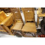 Pair of carved oak hall chairs. Not available for in-house P&P.