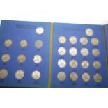 Complete set of silver shillings 1902-1936 in folder. P&P Group 1 (£14+VAT for the first lot and £