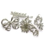 Four white metal marcasite set vintage brooches. P&P Group 1 (£14+VAT for the first lot and £1+VAT