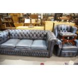 Contemporary blue leather Chesterfield style three seater sofa bed, wing back reclining armchair and