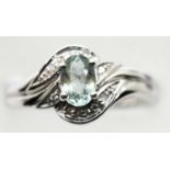 18ct white gold aquamarine and diamond ring, size O, 5.4g. P&P Group 1 (£14+VAT for the first lot
